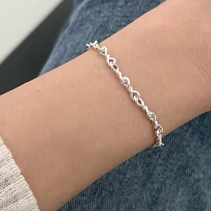 Minimalist S925 sterling silver beaded chain bracelet worn on a female wrist