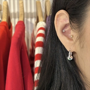 Polished S925 sterling silver hoop earrings with disc charm worn on earlobes