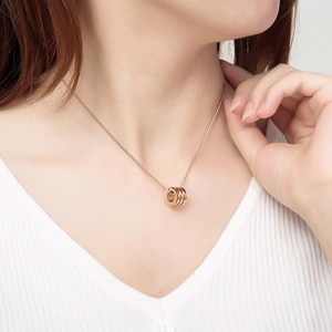 Rose gold stainless steel cylinder pendant necklace with sparkling inset diamonds