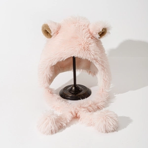 Detail of pink plush bucket hat with cute 3D ears and fluffy pom-pom drawstrings