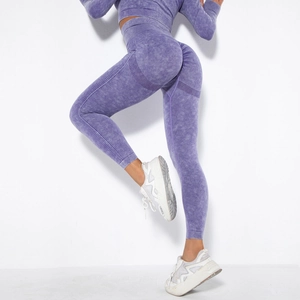 Macro shot of acid wash purple yoga pants showing textured fabric and ribbed details