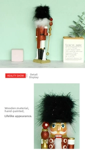 Detailed close-up of a 35cm wooden nutcracker with red sequin jacket and feather hat