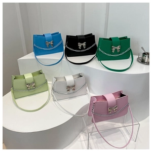 Detailed display of six colorful baguette bags with silver butterfly and chain accents