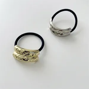 Minimalist geometric hammered metal hair ties in gold and silver finish with elastic band