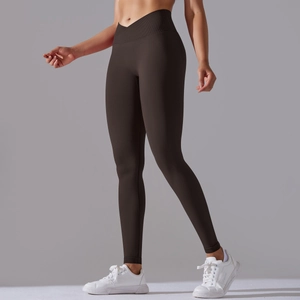 Detail of the V-shaped cross high waist design on deep brown seamless yoga leggings