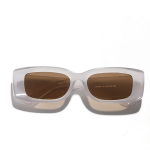 Modern retro rectangle sunglasses with translucent grey frames and brown lenses