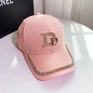 Pink baseball cap with rhinestone letter B and crystal brim edge in high fashion style