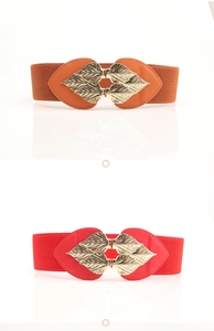 Detail of red and brown elastic waist belts with gold metal leaf-shaped buckles