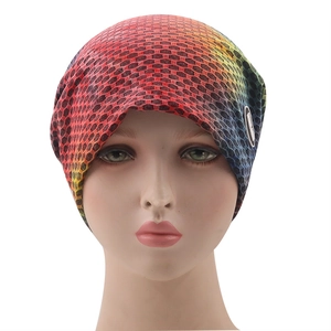 Rainbow gradient mesh knit beanie with side logo patch on model head for outdoor warmth