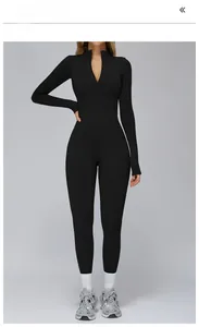 Close-up of black high-stretch thermal yoga jumpsuit with stand collar and zipper detail