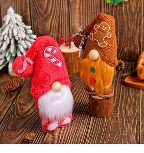 Charming Christmas gnomes with candy cane and gingerbread on rustic wooden background
