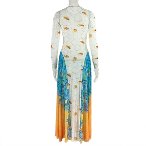 Detail of printed maxi dress with colorful goldfish and water pattern on white fabric