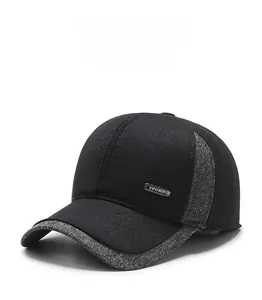 Detail of winter baseball cap with thick knit fabric and Sport metal emblem decoration