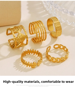 Detail of 18K gold-plated stainless steel ring set with geometric and textured bands