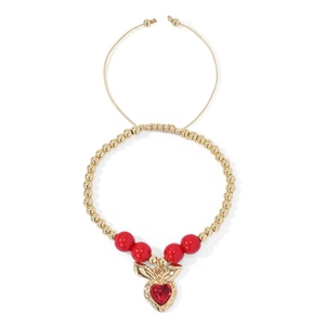 Detail of 18k gold beads and red heart pendant on a khaki braided adjustable bracelet