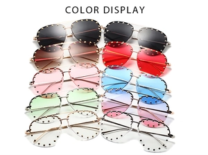 Multiple colors of pilot sunglasses with metal frames and rivet details on white background