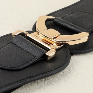 Women's wide elastic waist belt with geometric gold metal buckle on black leather strap