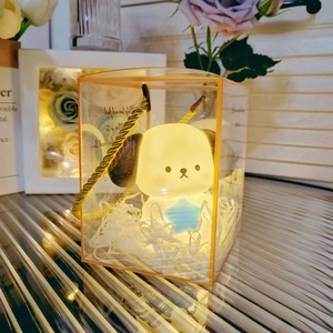 Glow Pochacco night light inside a transparent gift box with warm yellow light detail