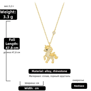 Detailed close-up of a winged unicorn pendant necklace with sparkling white rhinestones