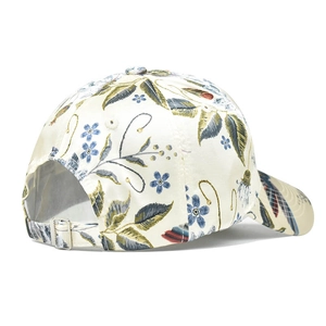 Detail view of floral baseball cap with metal buckle and adjustable fabric strap