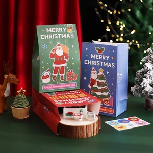 Christmas gift bags with festive stickers for candy and treats in red green and blue