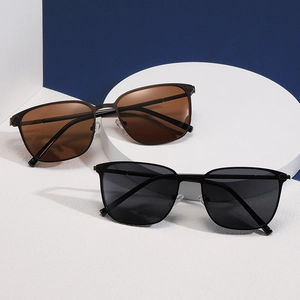 Vintage polarized square metal sunglasses in black and brown gradient on a geometric stand
