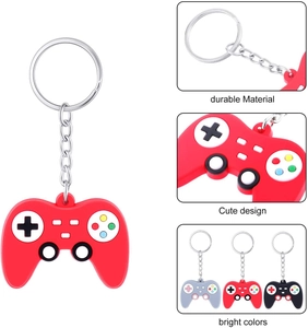 Macro detail of game controller silicone keychain with metal ring in red grey and black