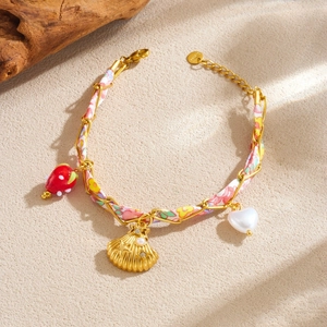 Marine style fabric woven bracelet with gold shell, heart pearl, and strawberry charms