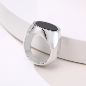 Polished silver stainless steel ring featuring a sleek oval black stone inlay