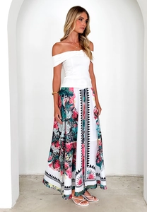 Close-up of the elegant ethnic floral print and texture on the summer long skirt