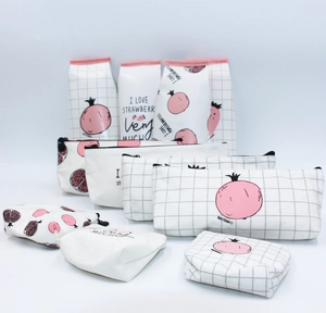 Macro shot of PU pencil cases showing strawberry prints and durable zipper closure