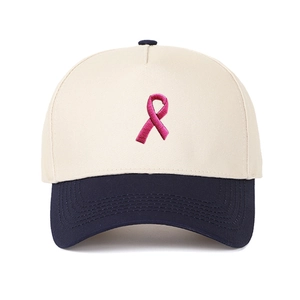 Beigefarbene und dunkelblaue Trucker-Baseballkappe mit rosa Schleifenstickerei-Detail