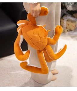 Detailed close-up of a large plush king crab toy with soft texture held in hands