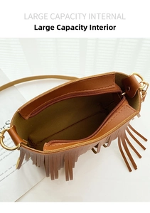 Top view of the spacious interior compartment of this brown bohemian tassel crossbody bag