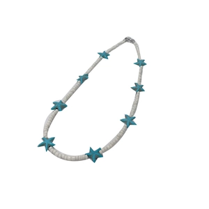 Bohemian seed bead necklace with blue starfish pendants and white beads on white background
