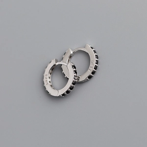 Detailed close-up of S925 sterling silver hoop earrings with inlaid black cubic zirconia