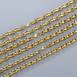 Detail showing multiple golden interlocking hollow bamboo chains with lobster clasps