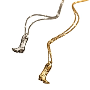 Retro cowboy boot pendant necklaces in silver and gold plating over stainless steel