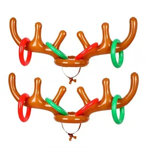 Macro view of inflatable reindeer antler headpiece and colorful rings for toss game