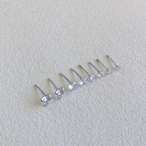 Macro shot of seven S925 sterling silver stud earrings with sparkling cubic zirconia stones