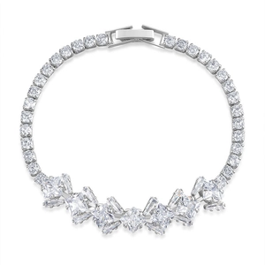 Detail of silver tennis bracelet with princess and baguette cut cubic zirconia stones
