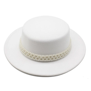 Detailed macro view of white wool boater hat with woven pearl decorative band and texture