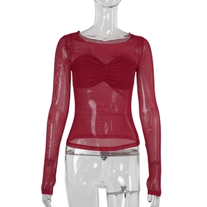Close-up of sheer mesh long sleeve top in burgundy with ruched bust detail
