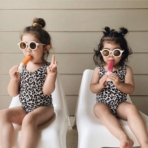 Classic leopard print one-piece swimsuit for toddlers with chic round matte sunglasses