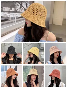 Collage of hollow knit bucket hats in seven colors showing woven texture and casual style
