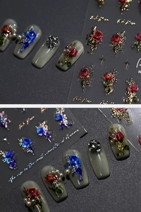 Detailed view of 3D vintage rose nail art stickers with gold accents and floral patterns