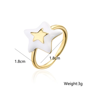 Detail view of 18K gold star ring with white enamel showing 1.8cm size and 3g weight