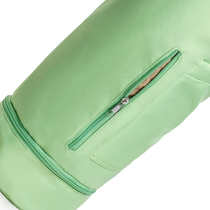 Close-up detail of smooth zippers and inner lining on a green yoga mat carry bag
