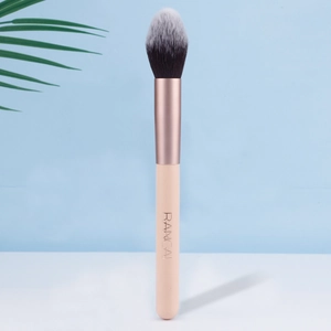 Close-up of soft gradient synthetic bristles and rose gold ferrule on makeup brush