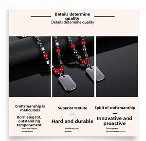 Macro view showing red beads and metallic pendant detail of this hematite necklace